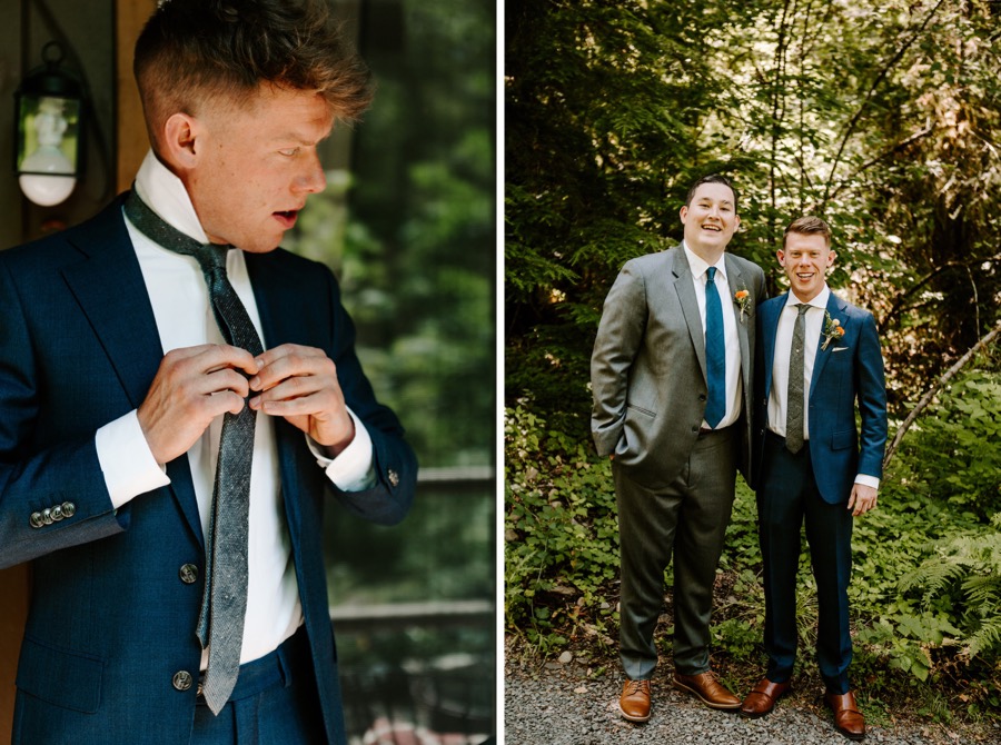 groom doing up tie and standing with best man