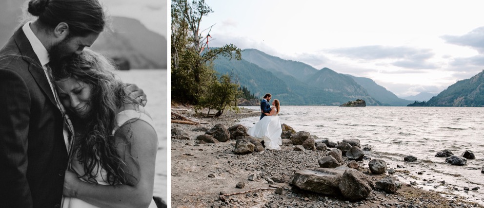 bride and groom stand together near water's edge with mountains in distance