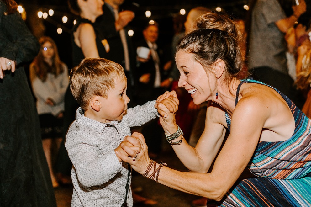 wedding guests dance during outdoor nighttime reception