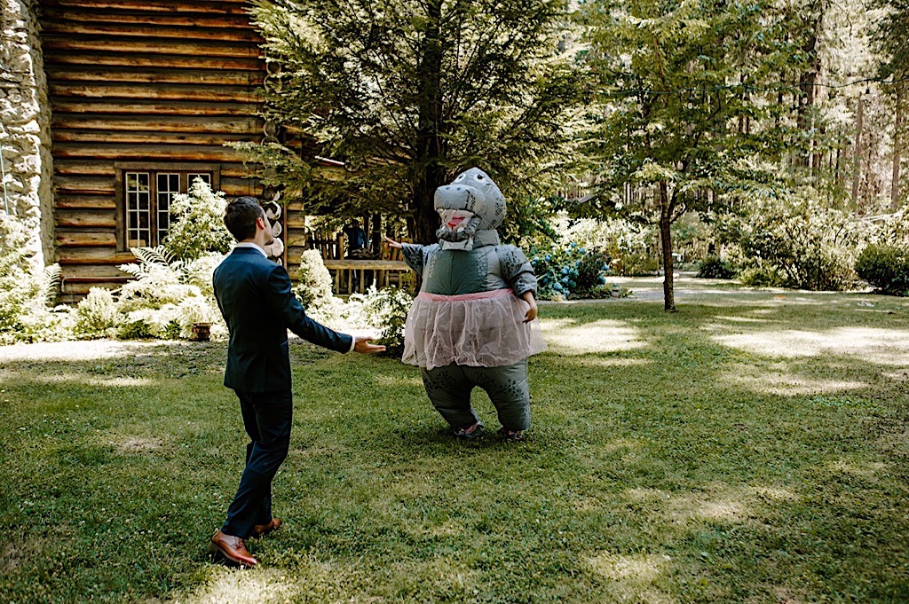 Surprise hippo suit bride and groom first look